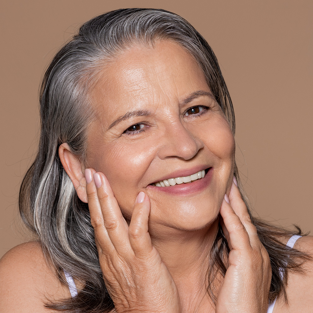 60 year old Hispanic woman with glowing skin